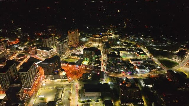 4K drone footage of building and traffic in Buckhead Atlanta. Dramatic aerial footage of illuminated city streets and lights.