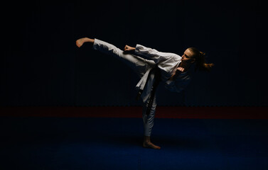 Teen girl doing Mawashi Geri