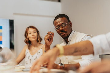 Diverse Business Team Discussing Profit Growth and Project Development at Office Table