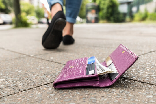 Close-up Of Woman Losing His Wallet