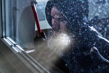 Burglar Looking Into A House Window