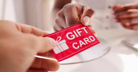 Holding Giving Gift Card Voucher