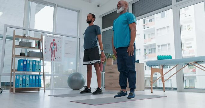 Black people, squat and personal trainer in physiotherapy, exercise or workout together at the clinic. African men in body warm up, healthcare or fitness for pilates, training or health and wellness