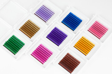 Mockup palettes of multi colored eyelash extensions: green, blue, pink, purple, light and dark...