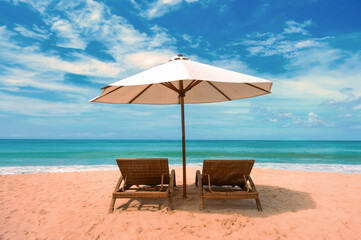 Beautiful beach. Chairs on the  sandy beach near the sea. Summer