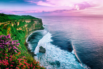 View of Uluwatu cliff with pavilion and blue sea in Bali, Indonesia - 639695043