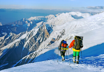 Two climbers descend from the summit of Everest in Nepal after a successful ascent. - 639695210