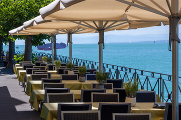 Empty tables of a restaurant on the Meersburg embankment