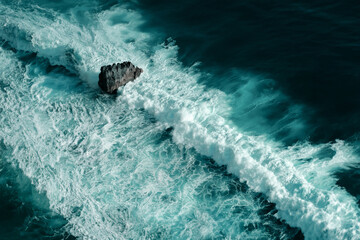 Aerial view of breaking ocean waves. Close up shot of a blue foaming waves - 639695467