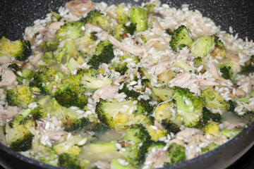 Cooking chicken and broccoli risotto