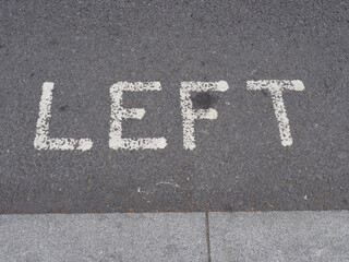 left sign painted on tarmac