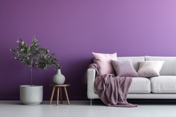 Sofa and pouf covered with blanket against purple wall with copy space. Minimalist interior design of modern living room