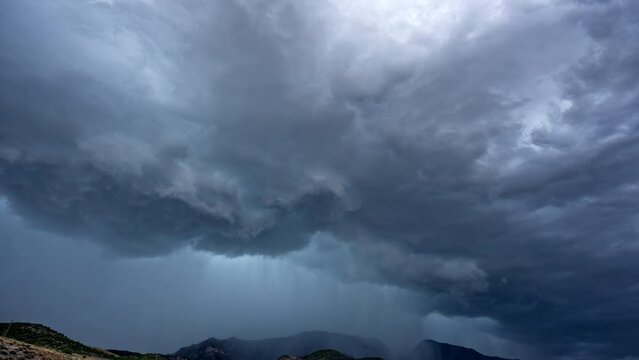 Timelapse of dramatic storm rolling over the mountains in Utah over Nebo during summer monsoon.