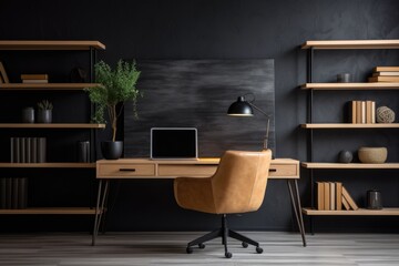 Workplace with wooden desk and black chair against of black wall with shelving unit. Interior design of modern scandinavian home office