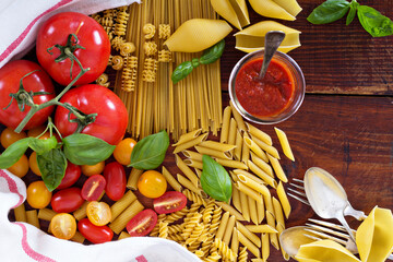 Pasta different types with tomatoes and basil