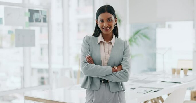 Business woman, portrait and smile with arms crossed in an office for confidence and career pride. Professional entrepreneur person from India at corporate company with positive attitude or happiness
