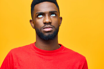 Obraz premium african man american fashion black afro orange beige red background american guy portrait