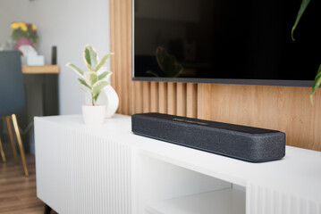 Soundbar in a modern home. Listening to music - obrazy, fototapety, plakaty