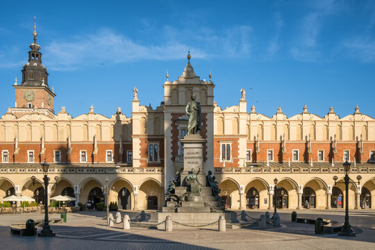 Statue of Adam Mickiewicz and Sukiennice buidning in Cracow, Poland