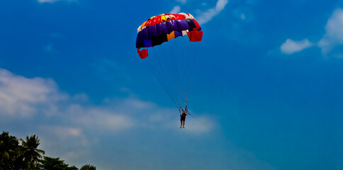Parasailing in the blue sky, Anyer beach, Indonesia