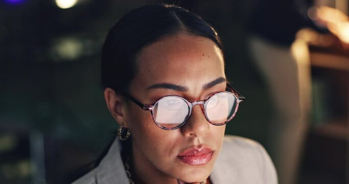 Night, reading and a woman with a computer in an office for an email, research or working on a project. Dark, serious and a corporate employee with glasses and knowledge on a pc for a deadline