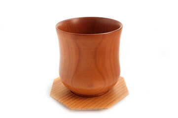 New empty wooden cup and plate on a white background. handcrafted cooking utensils, wood craft