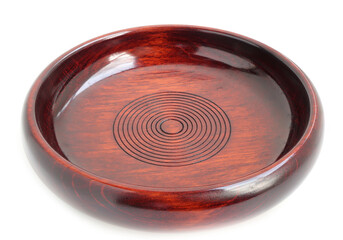 Empty new wooden plate on a white background. handcrafted cooking utensils 