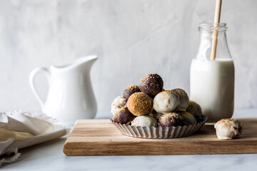 A scalloped dish filled with homemade pumpkin spice truffles.