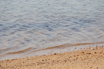 Beautiful scenery and sand beach with sea waves. Clear water of sea waves on the beautiful beach. 