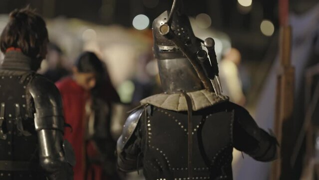 Medieval show - gladiators dressed in armor at a s