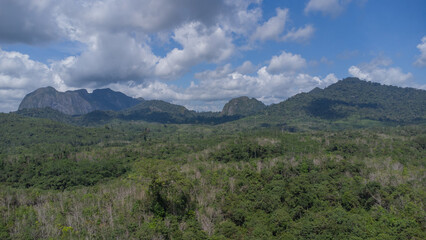 Aerial view of the clear lake with Meratus mountains in the background, the Tanah Bumbu district toll road to Banjar Baru