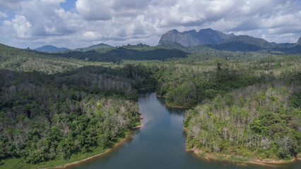 Fototapeta na wymiar Aerial view of the clear lake with Meratus mountains in the background, the Tanah Bumbu district toll road to Banjar Baru