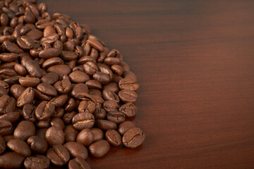 Aromatic Elegance: A close-up masterpiece capturing the intricate details of coffee beans on a rich wooden texture. The interplay of texture and aroma unfolds against a warm backdrop