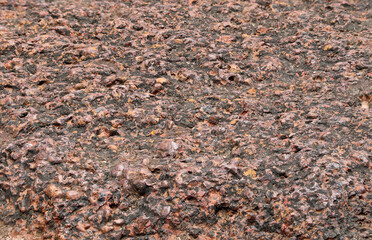 Close up of Red brown rock texture. Brown ground surface.Close up natural background.soil surface top view