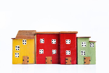 Colorful miniature houses arranged in a row on white background. business financial and rent, loan, property real estate, saving , investment concept.