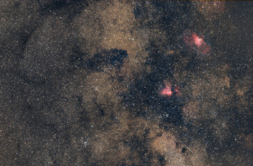 Deep Sky astrophotography of stars at the night sky with M16 and M17 nebulae in the constellation of Sagittarius