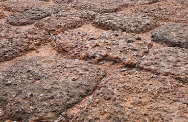 Close up of Red brown rock texture. Brown ground surface.Close up natural background.soil surface top view