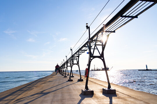 Sunlight shining through catwalk beams on pier at Grand Haven State Park in Grand Haven, Michigan, western Michigan, Lake Michigan, Great Lakes