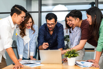 Group of creative asian business meeting and discussing strategy startup project analysis finance process.Success asian business people work plan and brainstorm marketing idea in office.Teamwork