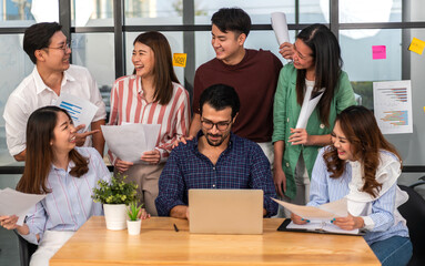 Group of creative asian business meeting and discussing strategy startup project analysis finance process.Success asian business people work plan and brainstorm marketing idea in office.Teamwork