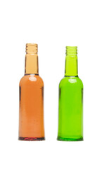 A picture of two empty glass bottles on white background.