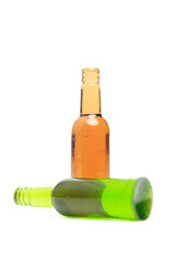 A picture of two empty glass bottles on white background.
