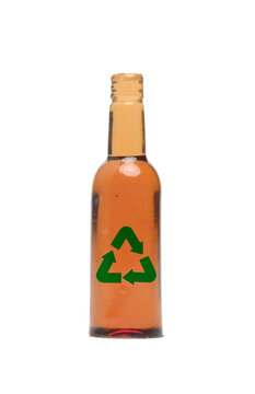 A picture of glass bottle with recycle sign on white background.
