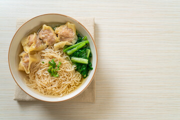 egg noodles with pork wonton soup or pork dumplings soup and vegetable
