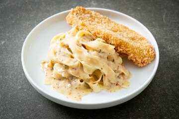 fettuccine pasta white cream sauce with fried fish