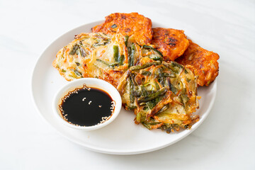 Pajeon or Korean pancake and Korean Kimchi pancake or Kimchijeon on white background