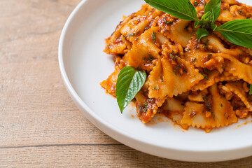 farfalle pasta with basil and garlic in tomato sauce