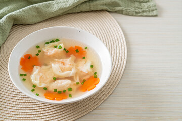 shrimp dumpling soup in white bowl