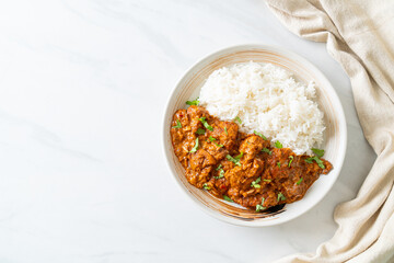 chicken tikka masala with rice on plate