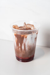iced chocolate with milk and strawberry syrup
